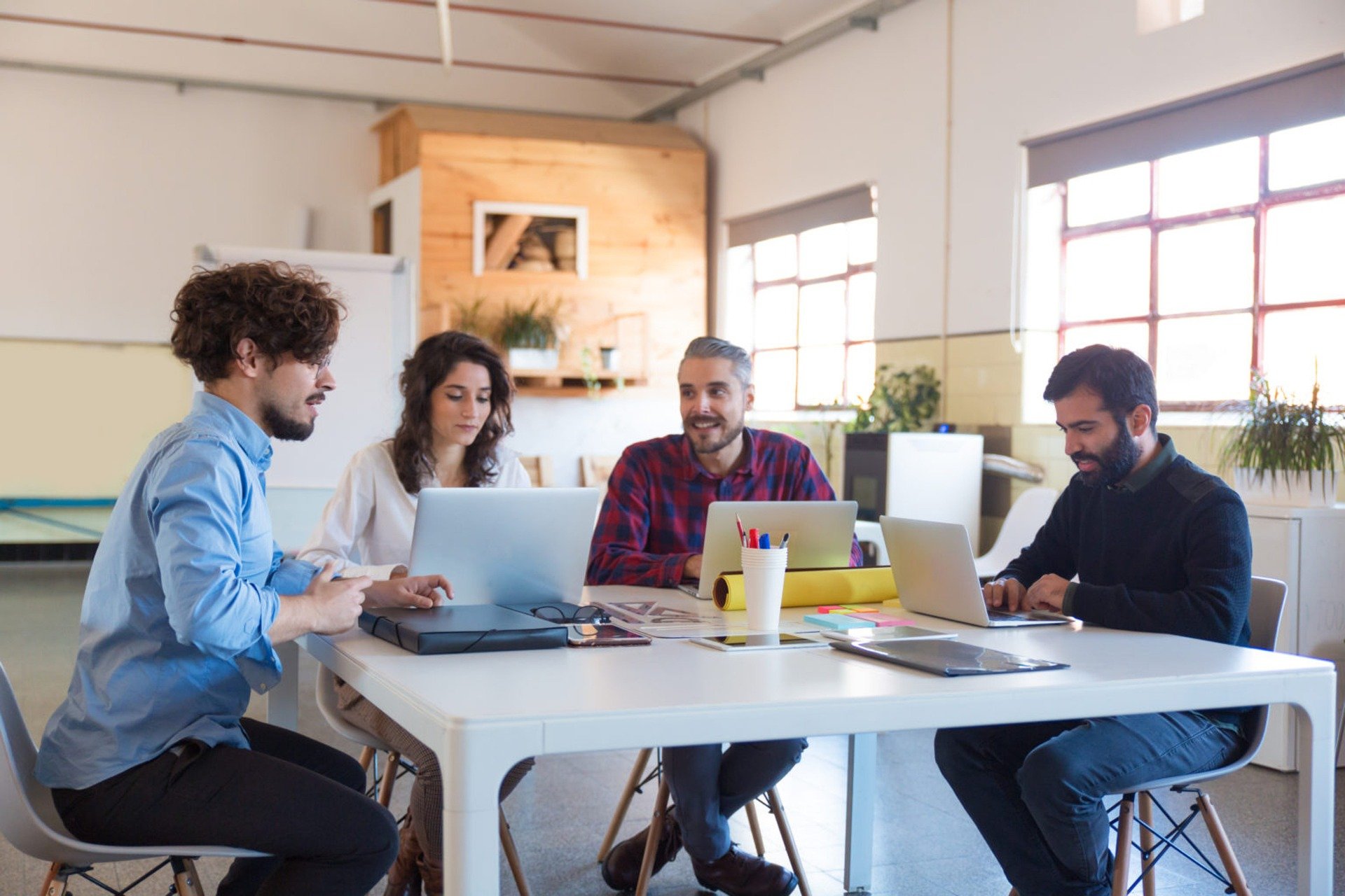 A group of people collaborating and sharing ideas to boost productivity and motivation.