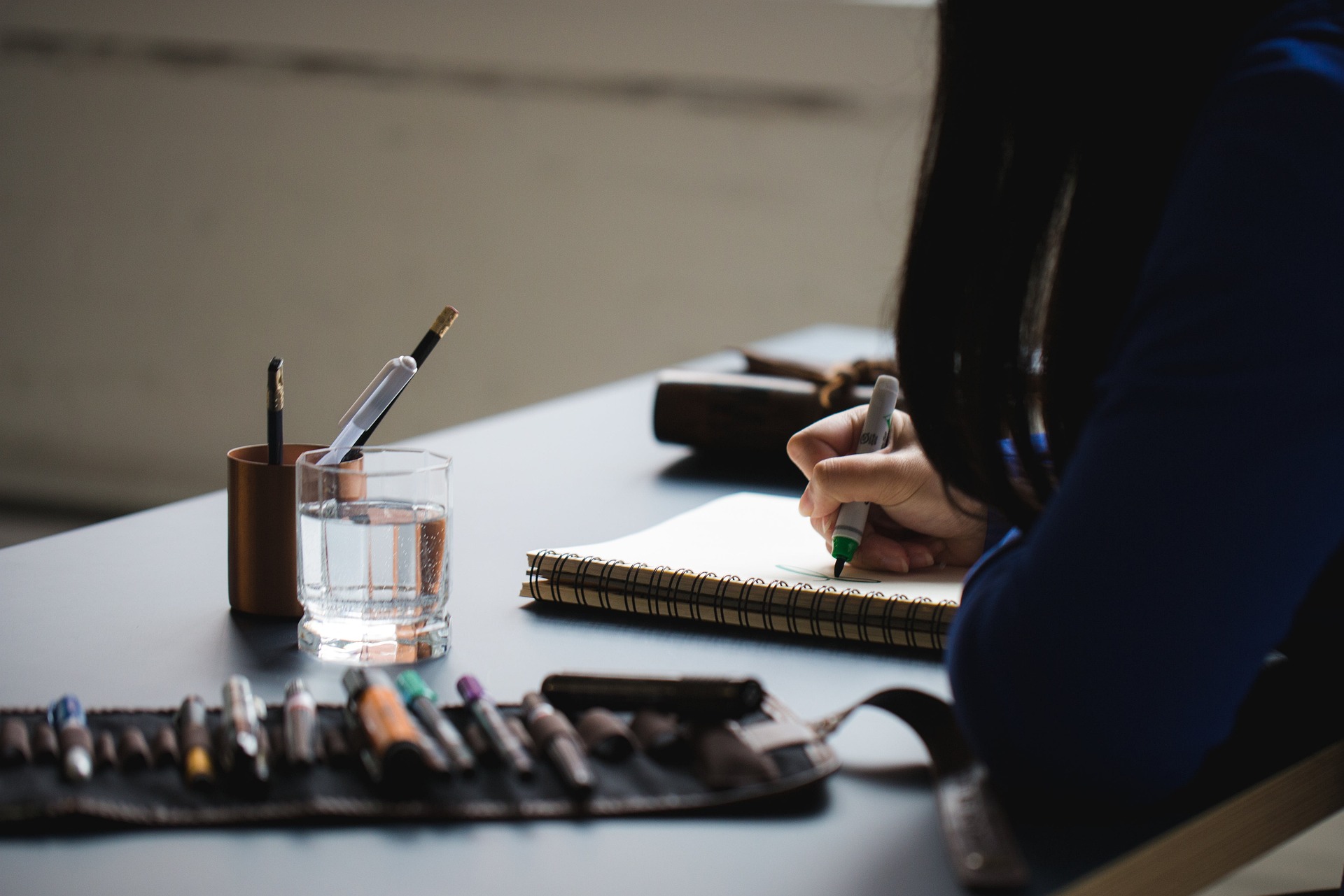 A peaceful morning setup with a notebook and coffee, symbolizing a productive start to the day.
